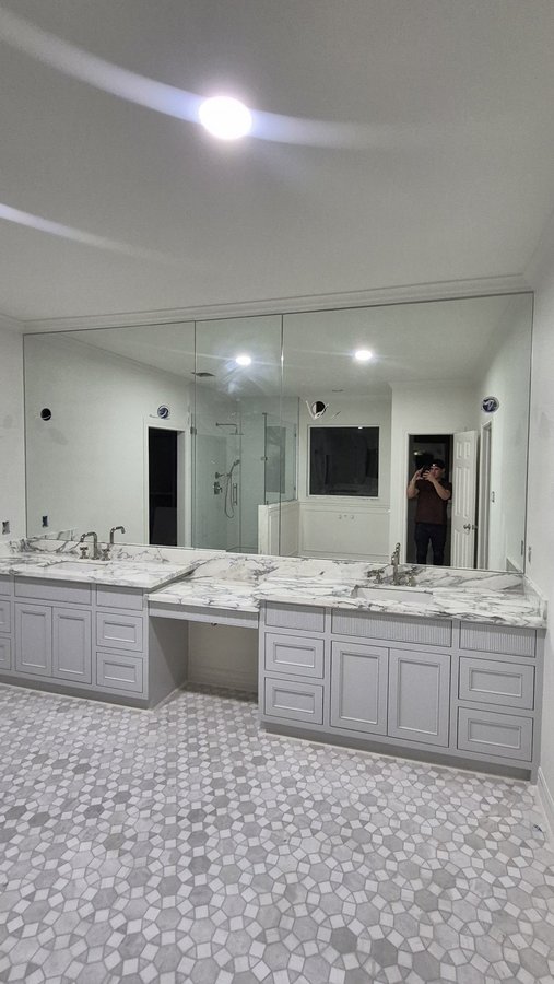 Glas Plus mirrors example: frameless polished mirrors over a marble double vanity