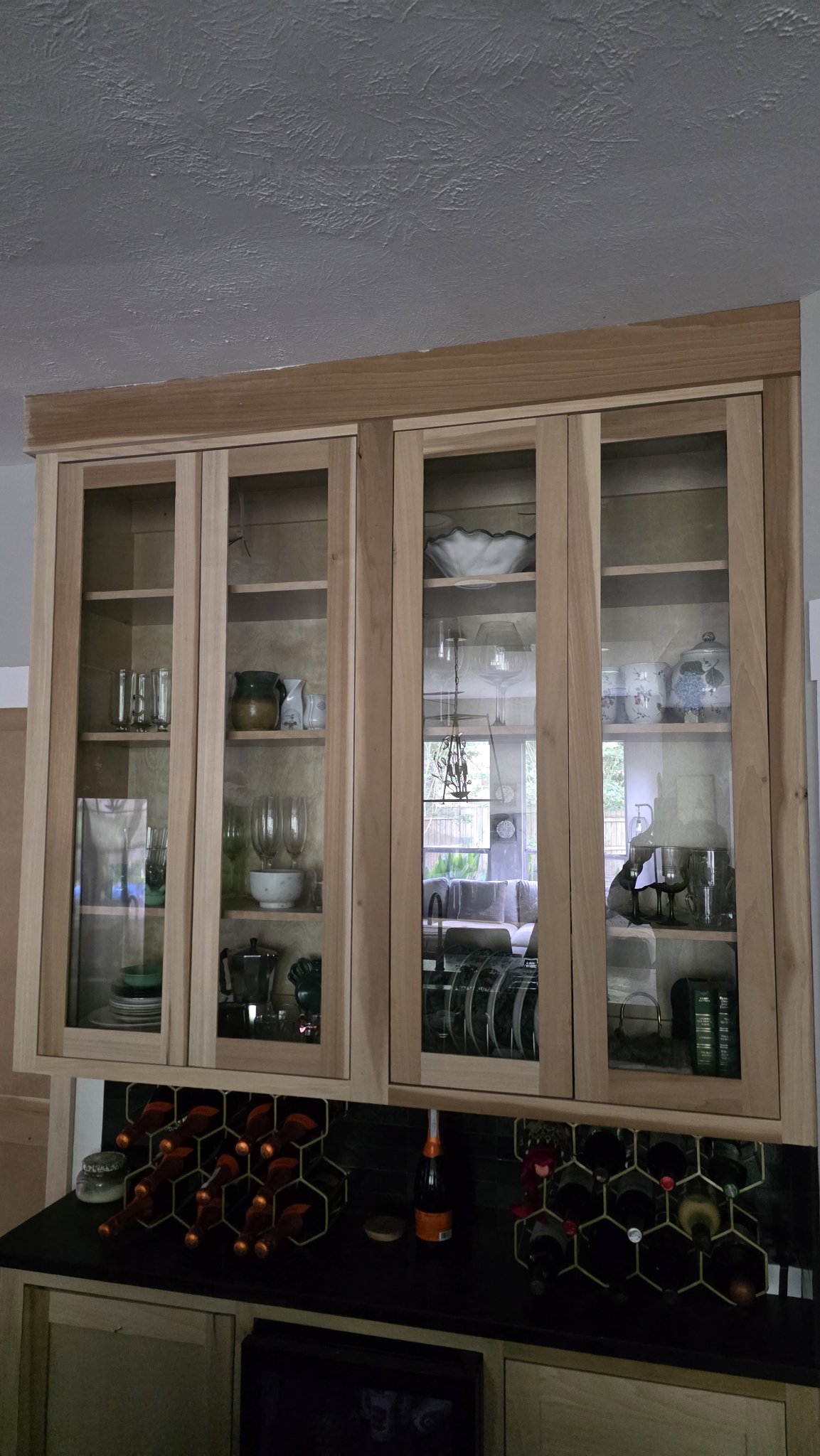 Glas Plus cabinet glass reference photo: display-cabinet style wood furniture with clear glass doors and dishware inside
