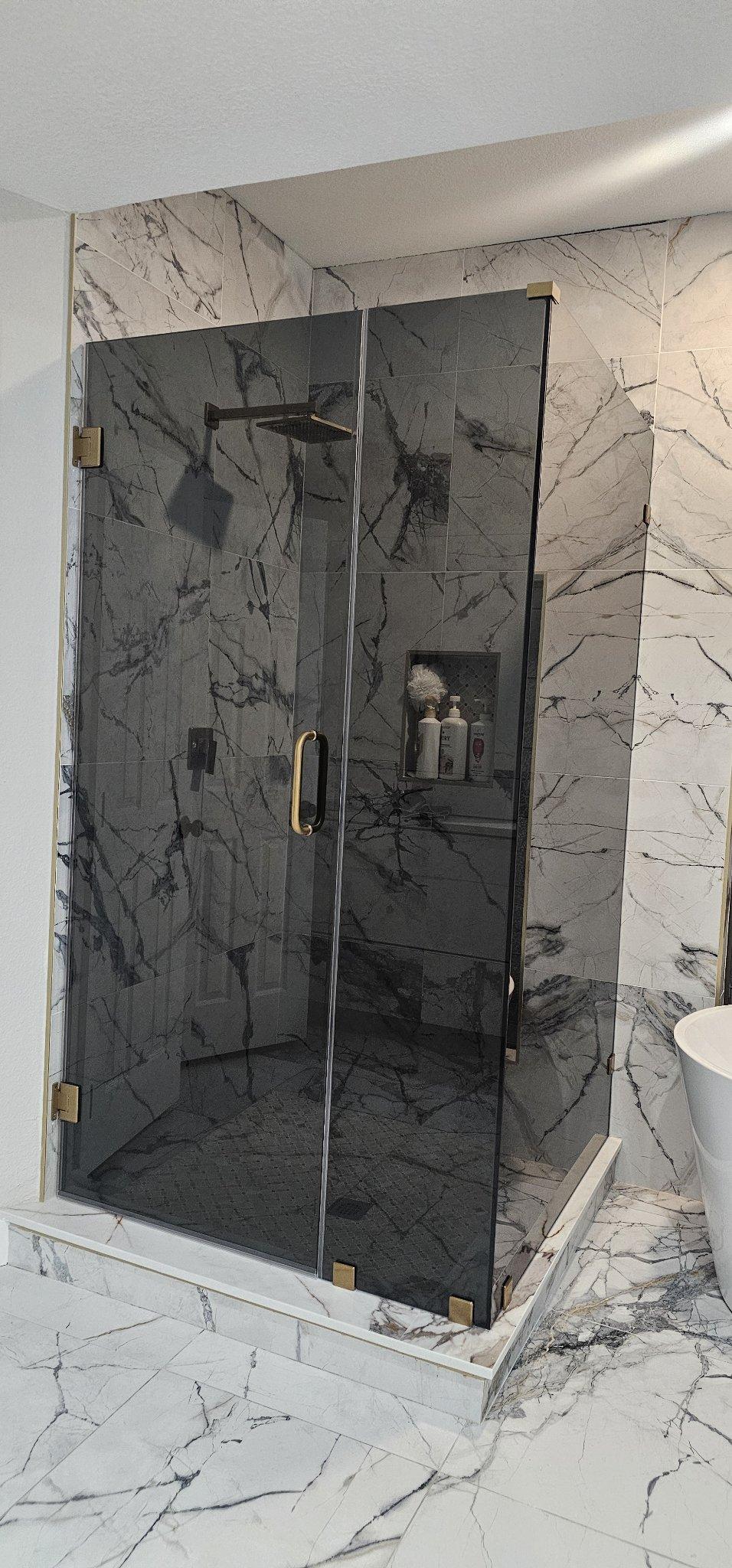 Glas Plus job: 90° angle shower with Grey glass (smoked grey) and gold hardware