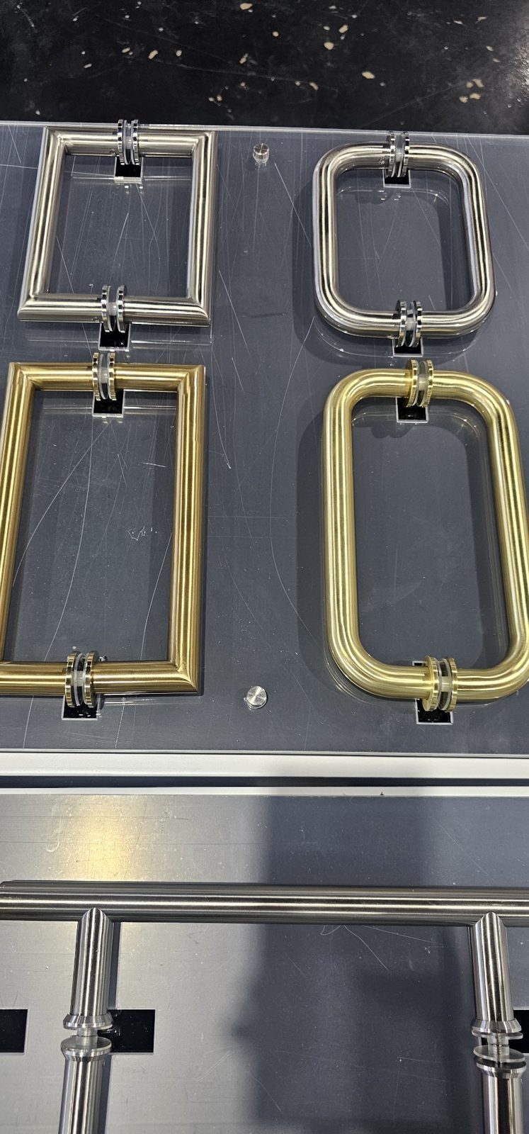 Glas Plus D-handle display: brushed nickel and chrome on top, brush gold below