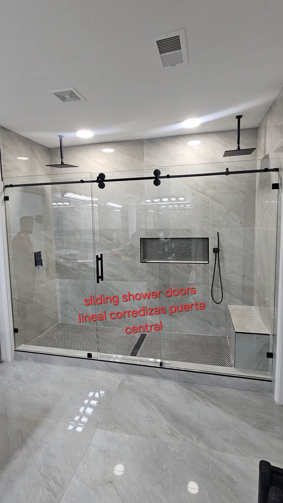 Straight-line sliding shower doors: sliding with a center door