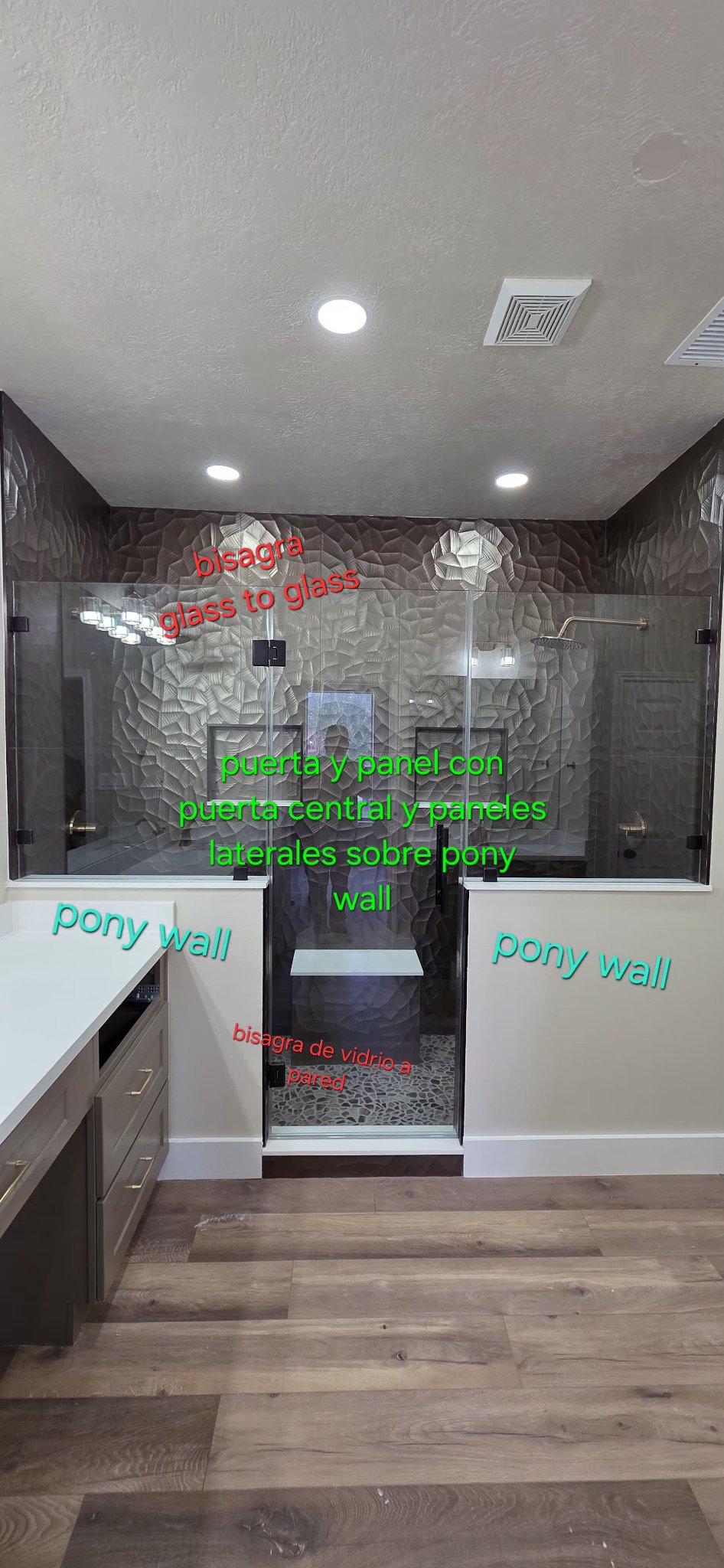 Center door and side panels on a pony wall · glass-to-glass hinge and glass-to-wall hinge