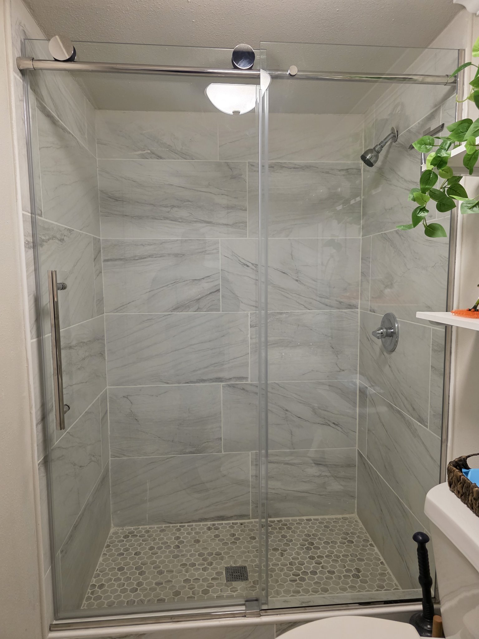 Soft-close sliding with chrome hardware and fixed panel installed by Glas Plus